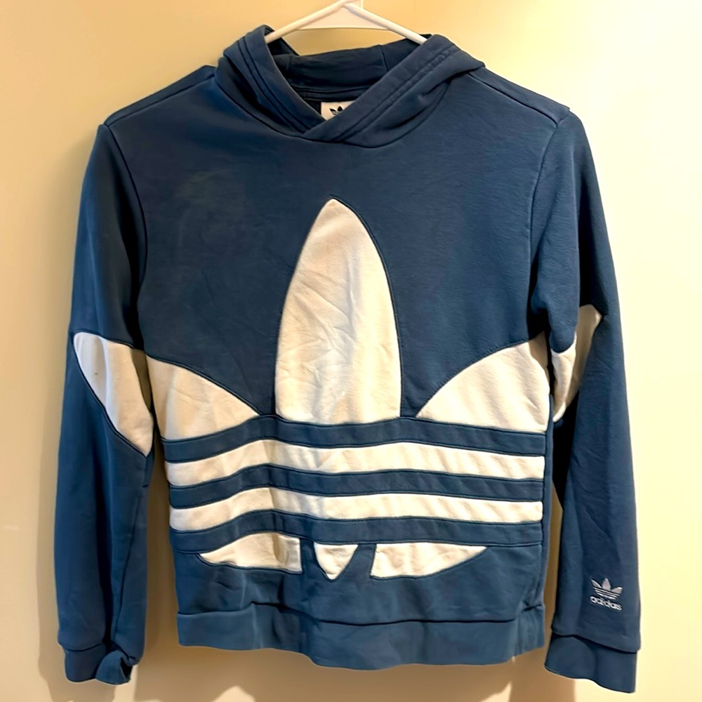 Adidas blue hoodie with block face logo on front